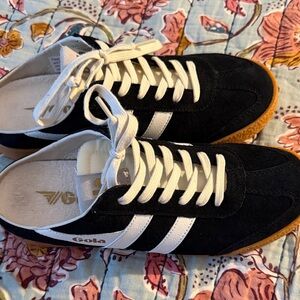Gola women’s Black Sneakers with White Stripes